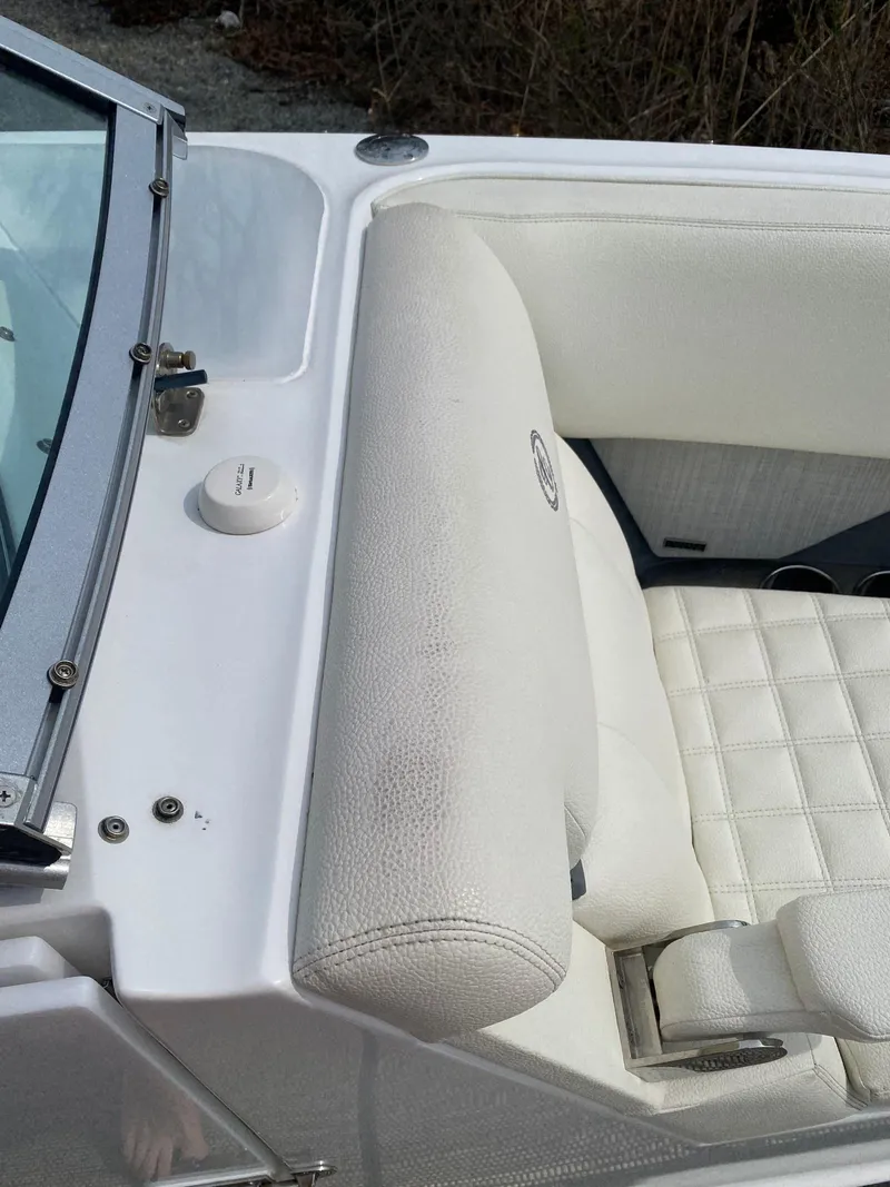 Slide: The Image of 2018 Cobalt R5 boat interior with white leather seating and windshield. - 15