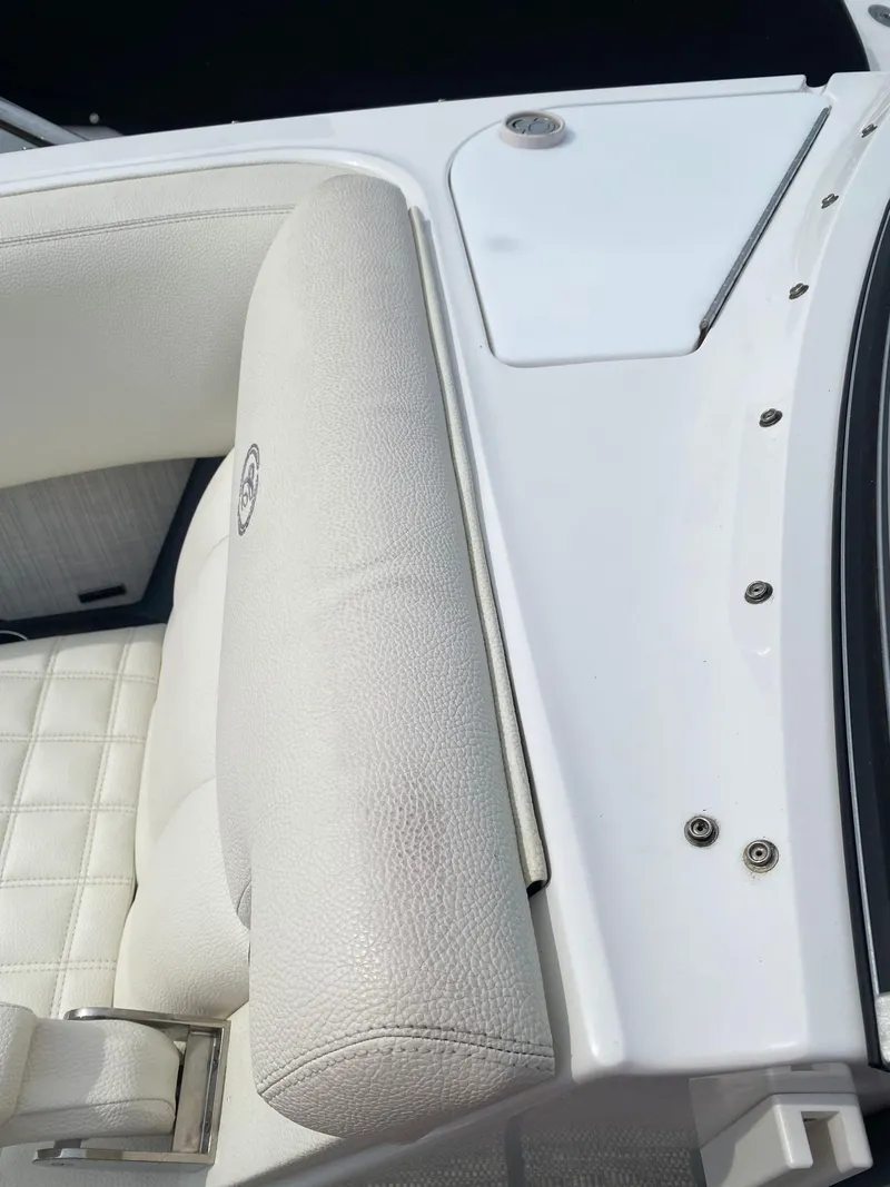 Slide: The Image of 2018 Cobalt R5 boat interior with white leather seating and sleek design. - 16