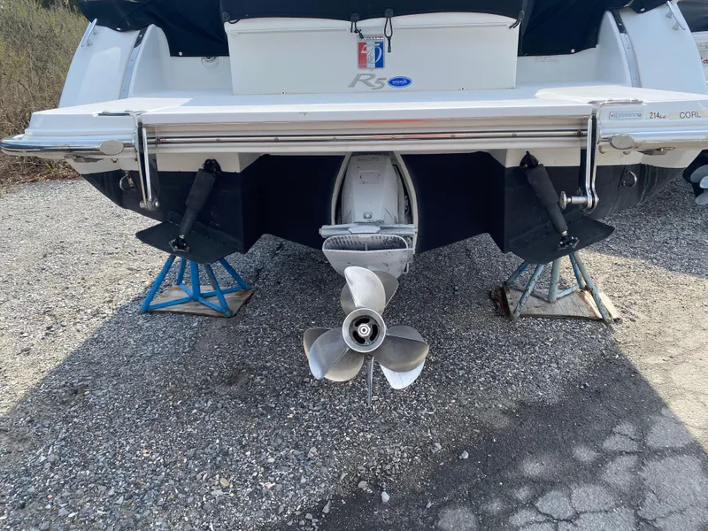Slide: The Image of 2018 Cobalt R5 boat stern with dual propellers on stands. - 19