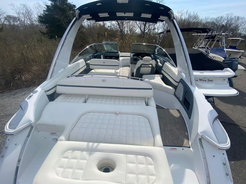 Slide: The Image of 2018 Cobalt R5 boat with spacious white seating and sleek design. - 2