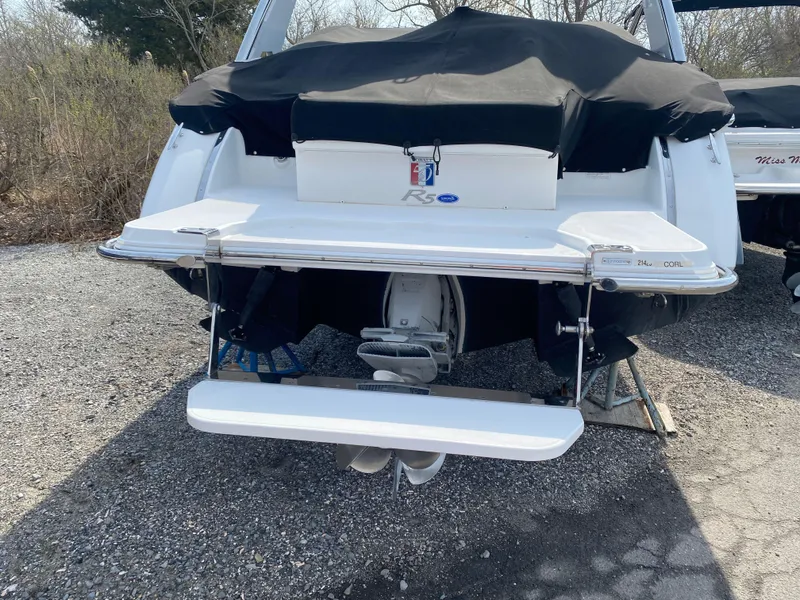 Slide: The Image of 2018 Cobalt R5 boat with covered deck and visible outboard motor. - 20