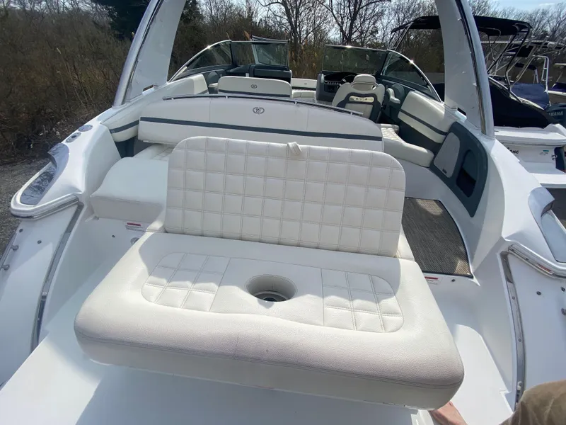 Slide: The Image of 2018 Cobalt R5 boat interior with white cushioned seating and sleek design. - 3