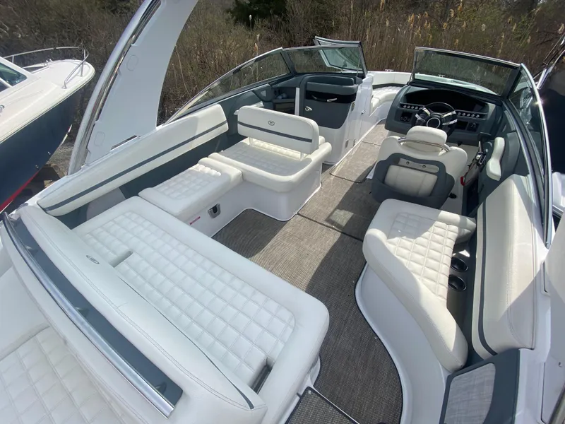 Slide: The Image of 2018 Cobalt R5 boat interior with white seating and modern dashboard. - 4