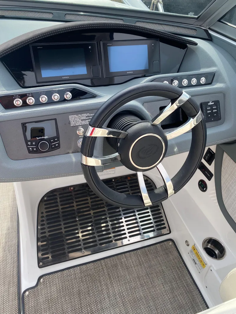 Slide: The Image of 2018 Cobalt R5 boat dashboard with steering wheel and digital displays. - 9