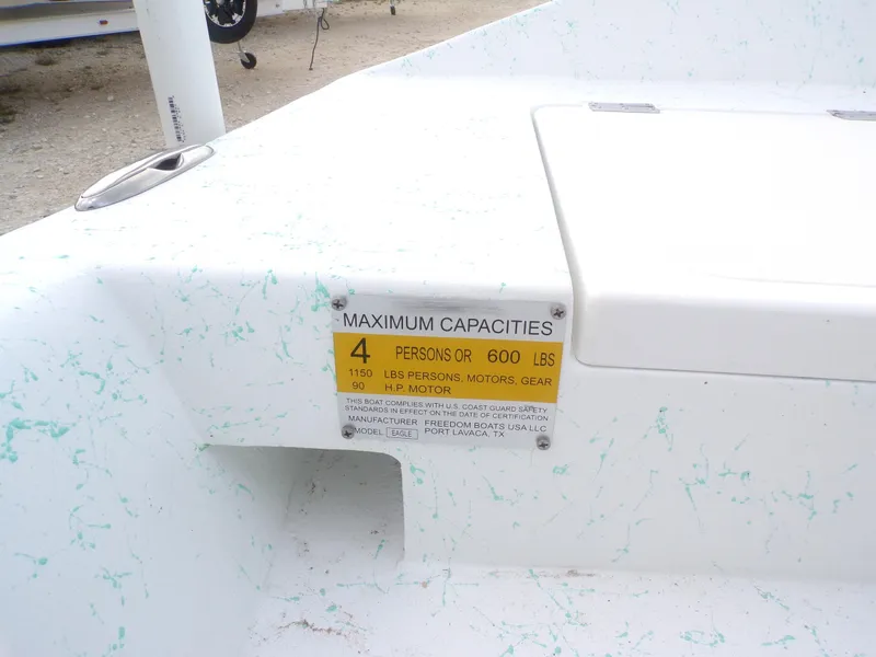 Slide: The Image of Boat capacity label on Freedom Eagle 16, 2025 model, showing limits for persons and weight. - 15