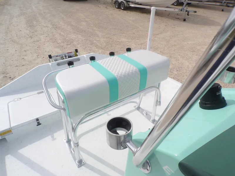 Slide: The Image of Boat seat on 2025 Freedom Eagle 16, featuring teal and white design. - 23
