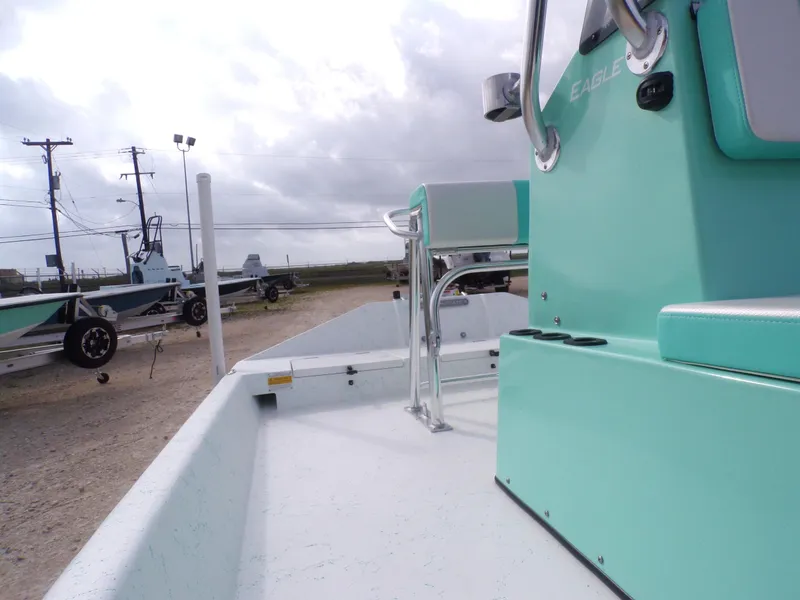 Slide: The Image of 2025 Freedom Eagle 16 boat in a parking lot, showcasing mint green console. - 26