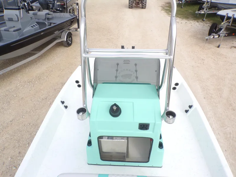 Slide: The Image of 2025 Freedom Eagle 16 boat console with teal accents and stainless steel railings. - 27