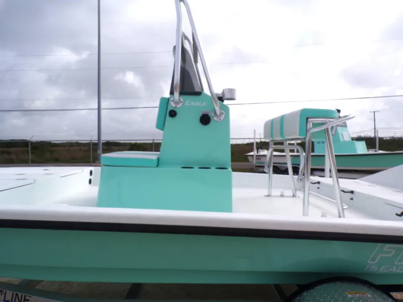 Slide: The Image of 2025 Freedom Eagle 16 boat with teal accents, featuring a sleek design and modern seating. - 28