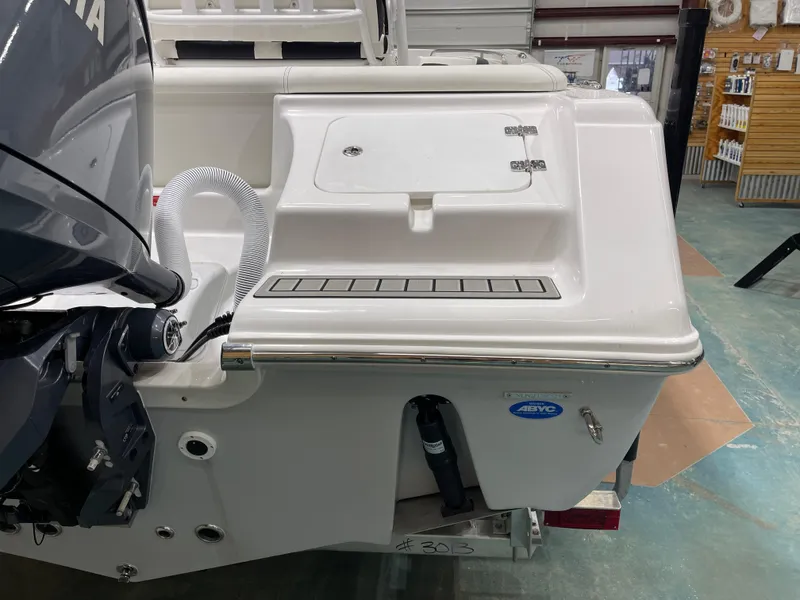 Slide: The Image of 2025 Tidewater 220LXF boat stern with Yamaha engine in a showroom. - 10