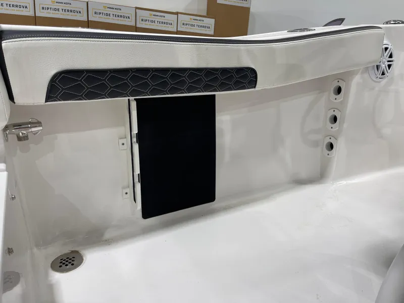 Slide: The Image of 2025 Tidewater 220LXF boat interior with sleek seating and storage compartments. - 27