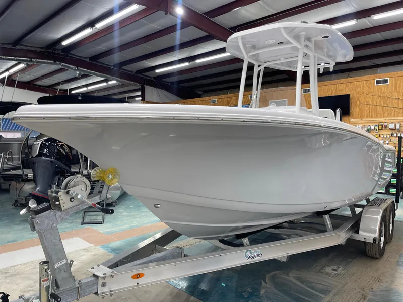 Slide: The Image of 2025 Tidewater 220LXF boat on trailer in indoor showroom. - 6