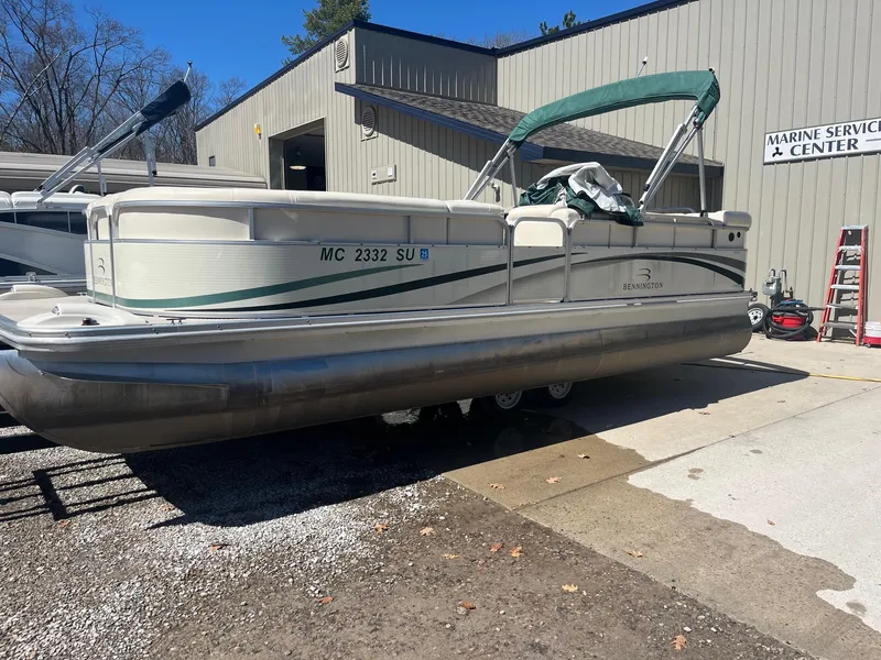 Slide: The Image of 2004 Bennington 2250 RL pontoon boat at a marine service center. - 7