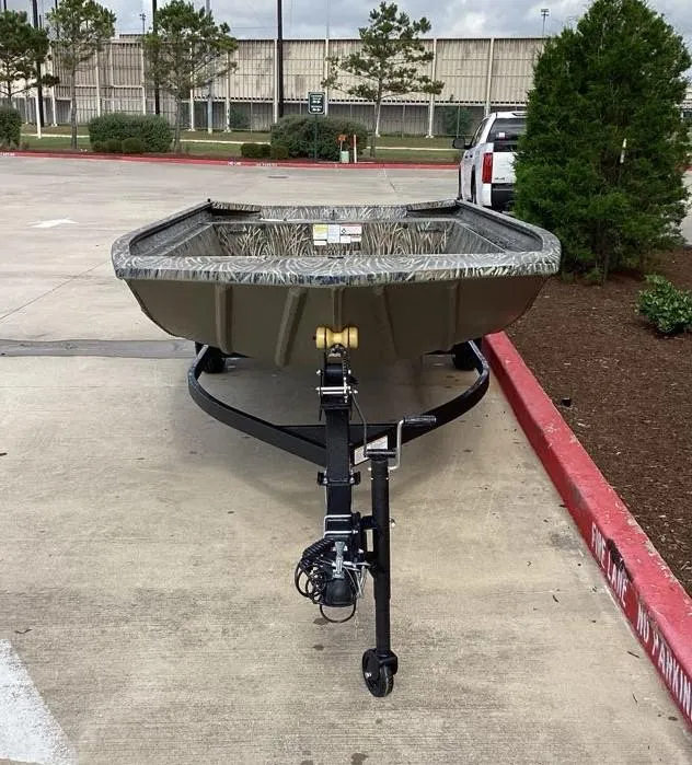 Slide: The Image of 2025 Tracker GRIZZLY 1860 Utility boat on trailer in parking lot. - 5