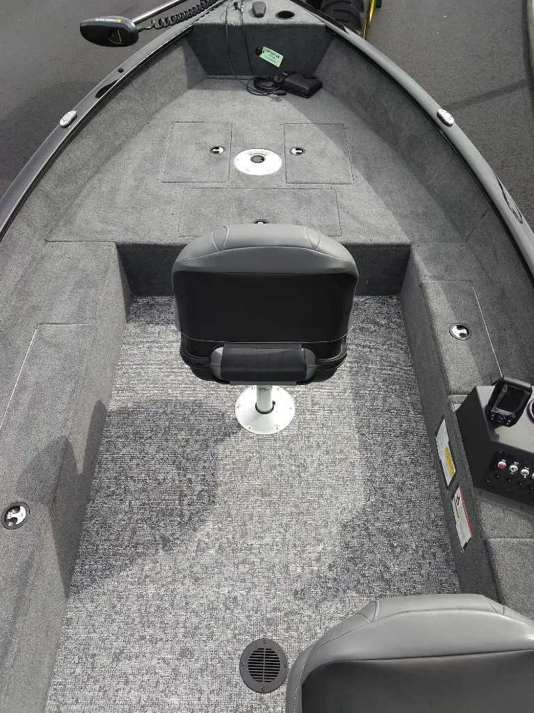 Slide: The Image of 2025 Tracker Super Guide V-16 T boat interior with seating and control panel. - 3