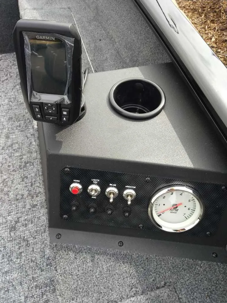 Slide: The Image of Control panel of 2025 Tracker Super Guide V-16 T with Garmin device and gauges. - 4