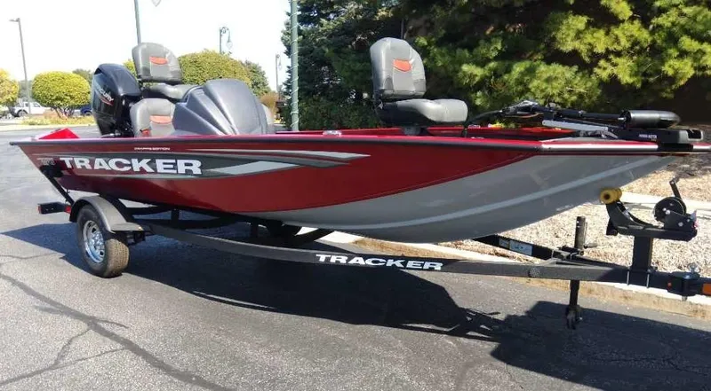 Slide: The Image of 2025 Tracker Pro Team 175 Crappie Edition boat on trailer, red and gray design. - 2