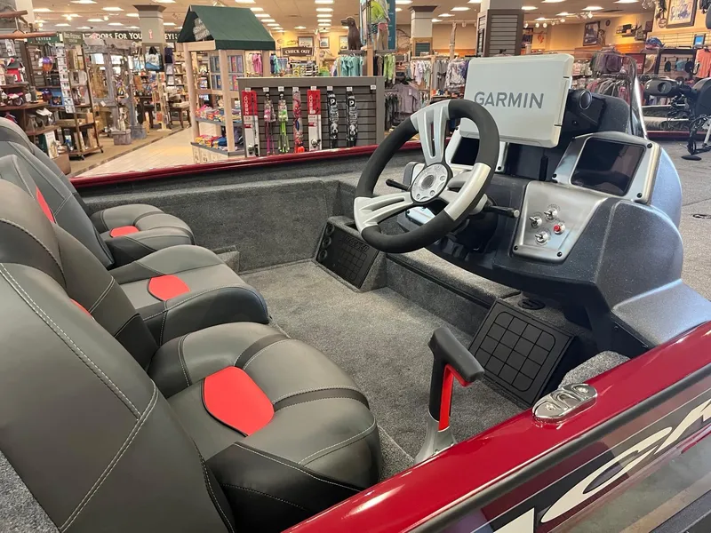 Slide: The Image of Interior of 2025 Tracker Savage 215 boat with Garmin navigation system. - 6