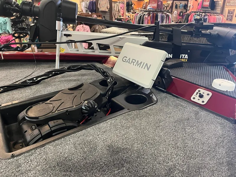 Slide: The Image of 2025 Tracker Savage 215 boat with Garmin navigation system on deck. - 7