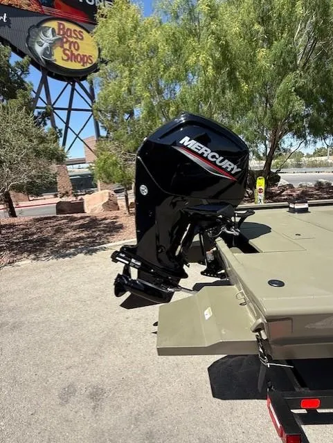 Slide: The Image of 2025 Tracker Grizzly 1860 CC boat with Mercury outboard motor near Bass Pro Shops. - 10
