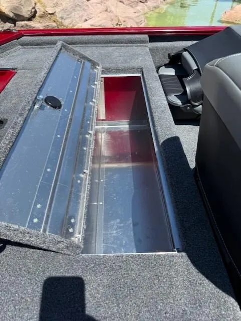 Slide: The Image of 2025 Tracker Pro 170 boat with open storage compartment and seating. - 8