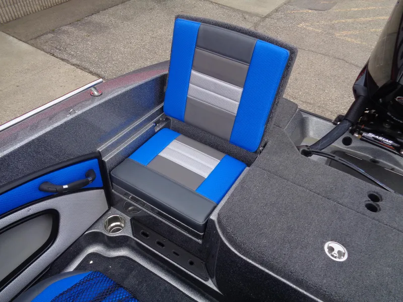 Slide: The Image of 2025 Ranger 1850MS boat interior with blue and gray seating, showcasing modern design. - 13