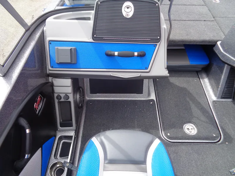 Slide: The Image of 2025 Ranger 1850MS boat interior with blue accents and modern dashboard design. - 15