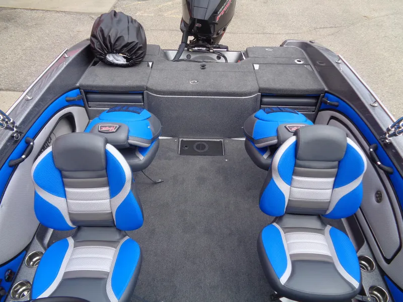 Slide: The Image of 2025 Ranger 1850MS boat interior with blue and gray seating, spacious layout. - 8