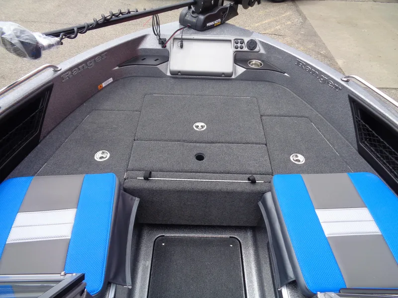 Slide: The Image of 2025 Ranger 1850MS boat interior with blue and gray seating, advanced navigation system. - 9