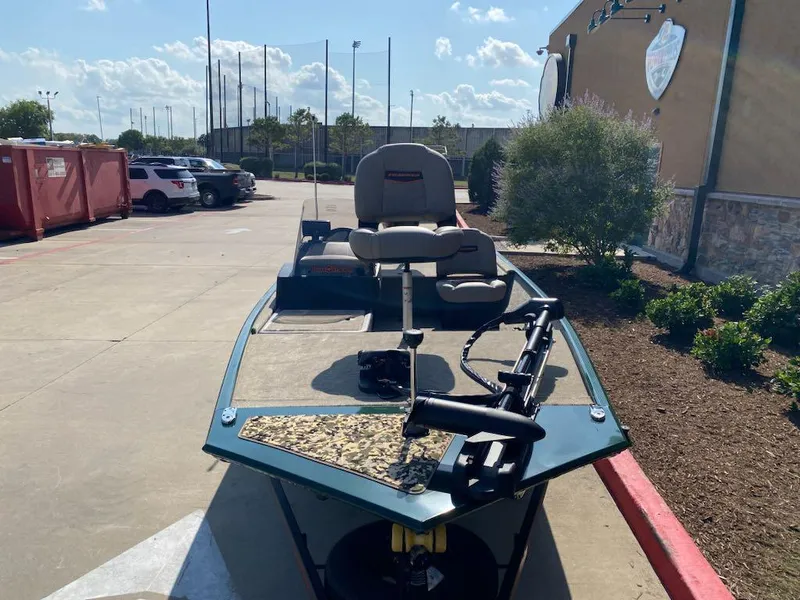 Slide: The Image of 2025 Tracker Bass Tracker Classic Limited boat parked outdoors on a sunny day. - 3