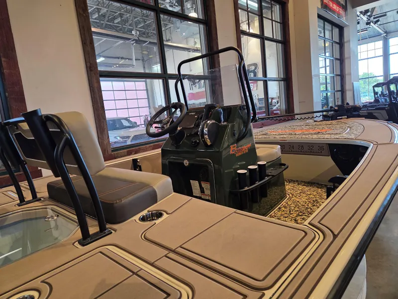 Slide: The Image of 2025 Mako 18 Pro Skiff Backwater Edition boat interior with seating and control console. - 3