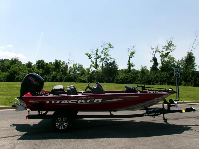 The Image of 2025 Tracker Pro Team 195 Tournament Edition boat on trailer, parked outdoors. - 0