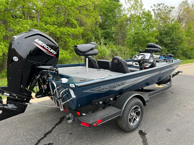 Slide: The Image of 2025 Ranger RT178 boat deck with motor and seat. - 4