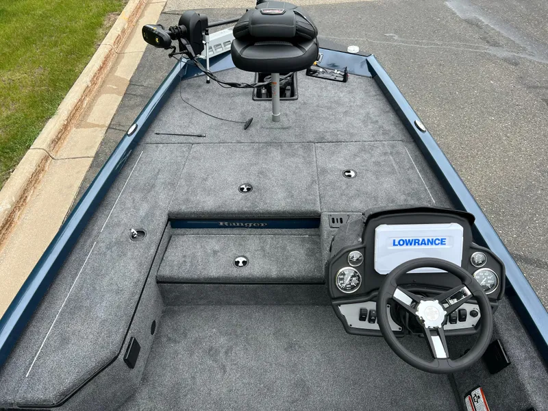 Slide: The Image of 2025 Ranger RT178 boat interior with three gray seats and steering wheel. - 6