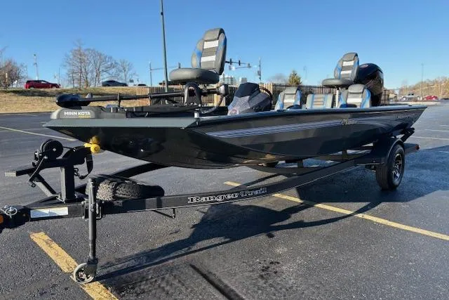 Slide: The Image of 2025 Ranger RT188P fishing boat on trailer in parking lot, sunny day. - 97