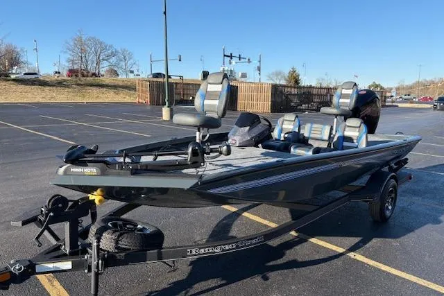 Slide: The Image of 2025 Ranger RT188P fishing boat in parking lot, featuring sleek design and modern seating. - 98