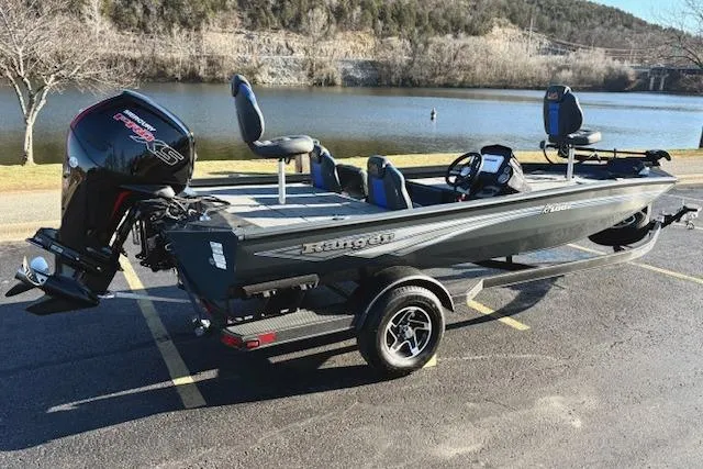 Slide: The Image of 2025 Ranger RT188P fishing boat parked by a scenic lake. - 99
