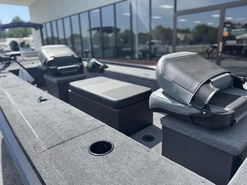 Slide: The Image of 2025 Tracker Panfish 17 boat interior with seating and storage compartments. - 2