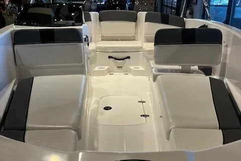 Slide: The Image of 2025 Tahoe T16 boat interior with white and black seating arrangement. - 2