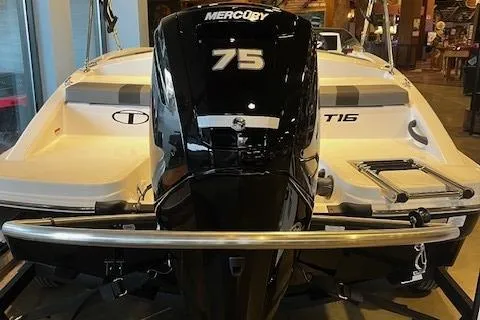 Slide: The Image of 2025 Tahoe T16 boat with Mercury 75 engine, rear view in showroom. - 3