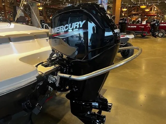 Slide: The Image of 2025 Tahoe T16 boat with Mercury outboard motor in showroom setting. - 4