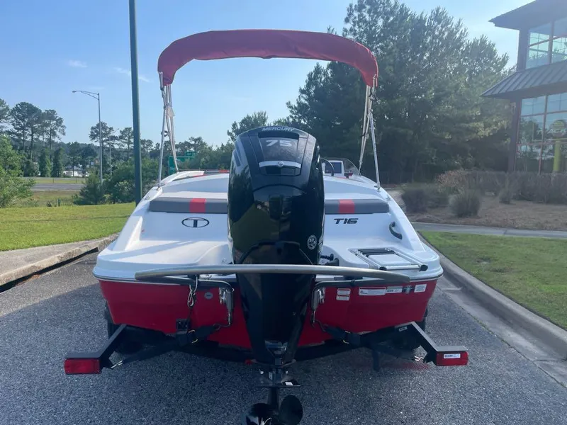 Slide: The Image of 2025 Tahoe T16 boat with outboard motor, parked on a sunny day. - 4