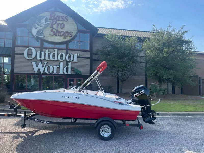 Slide: The Image of 2025 Tahoe T16 boat on trailer outside Bass Pro Shops Outdoor World. - 5