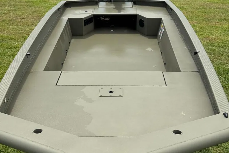Slide: The Image of 2025 Tracker Grizzly 1650 T Prairie Wings Edition boat interior, showcasing spacious deck design. - 6