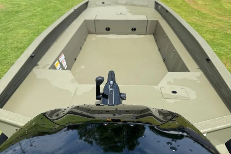 Slide: The Image of 2025 Tracker Grizzly 1650 T Prairie Wings Edition boat interior, featuring spacious seating and controls. - 7