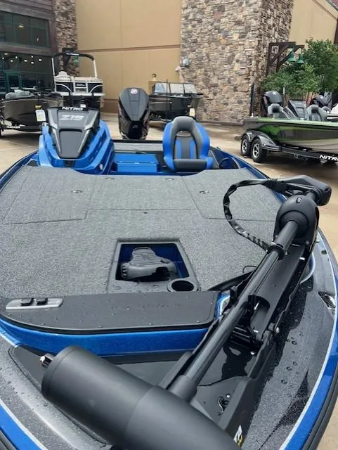 Slide: The Image of 2025 Nitro Z19 boat with sleek design and modern features, displayed outdoors. - 4