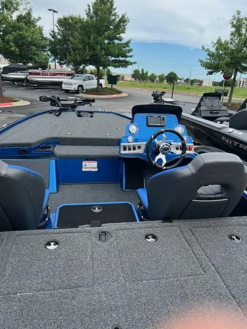 Slide: The Image of 2025 Nitro Z19 boat interior with blue accents and modern dashboard. - 6
