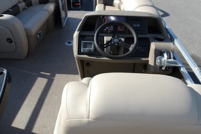 Slide: The Image of Interior view of 2025 Sun Tracker Party Barge 22 RF DLX pontoon boat helm. - 21