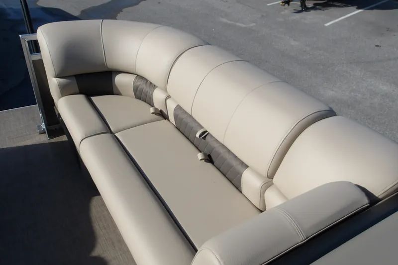 Slide: The Image of 2025 Sun Tracker Party Barge 22 RF DLX, luxurious beige seating on deck. - 18