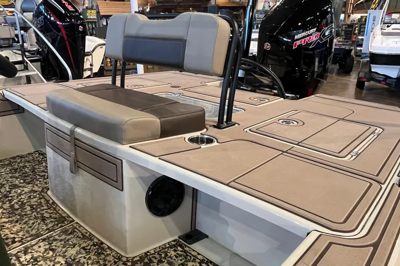 Slide: The Image of 2025 Mako 18 Pro Skiff Backwater Edition boat interior with seating and storage compartments. - 10